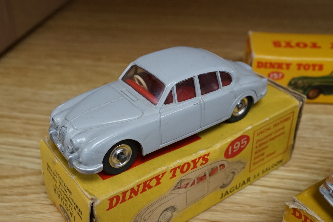 Six boxed Dinky Toys cars; Cunningham C-5R (133), Jaguar 3.4 saloon (195) in grey, Packard convertible (132) in fawn, Jaguar XK120 (157) in dark red (in a reproduction box), Humber Hawk (165) in two-tone green and black,
